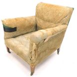 A Victorian Howard & Sons armchair, with original monogram standing on square tapering legs with