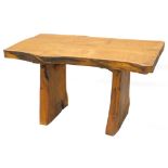 An oak small dining table, constructed from a slice of natural oak, on similar end supports, 74cm H,