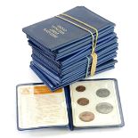 Ten blue plastic folders, containing Britians first decimal coins.