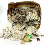 A large quantity of unsorted cigarette and trade cards, etc.