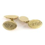 A pair of 9ct gold oval cufflinks, bearing the initials DBO, with engine turned decoration to the