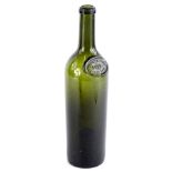 An early 20thC French green glass bottle, with label for Chateau Lafite 1902, Grand Vin, 30cm H.