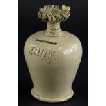 A 19thC white stoneware money box, with birds nest finial, impressed John, 17cm H. (AF)