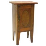 A late 19th/early 20thC oak bedside cabinet, with a single panel door, 46cm W.