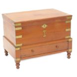 An Eastern teak and brass bound campaign type work box, the hinged lid enclosing a fitted interior