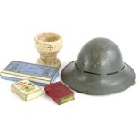 Miscellaneous items, to include a grey painted military type helmet, a small carved marble font,