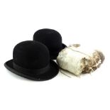 Two gentlemens' bowler hats, labels for Unitas and Hope Brothers and a feather muff.