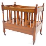 A mahogany three division Canterbury, with a frieze drawer on castors, 55cm W.