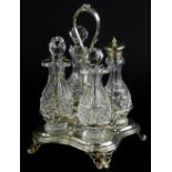 A Victorian four bottle cruet, with leaf cast scroll handle, shaped base, and four scroll cast feet,