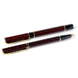 A Waterman pen set, each in red and deep red and black, in a fitted box.