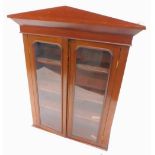 A Victorian mahogany and pine bookcase, with an arched cornice above two glazed doors, 90cm W.