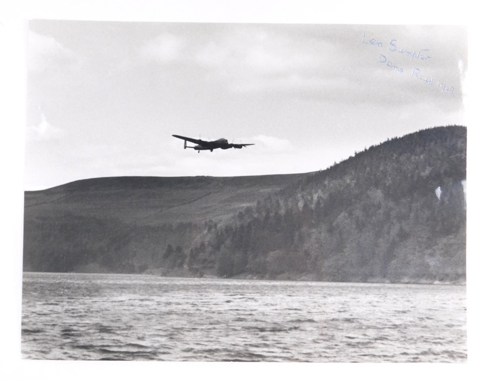 A photograph of the Lancaster flying over the Derwent Dam, signed by Dambuster Len Sumpter, together - Image 2 of 6