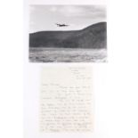 A photograph of the Lancaster flying over the Derwent Dam, signed by Dambuster Len Sumpter, together