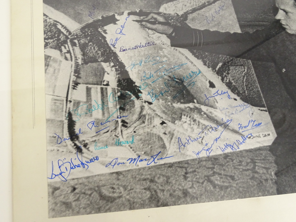 A photograph of Guy Gibson about to sign a chart for The Mohne Dam Raid, with many signatures - Image 2 of 6