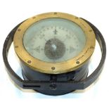 A 20thC metal cased compass, of circular form, with articulated inner dial, 17cm diameter.