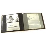 An early 20thC photograph album, showing black and white photographs of various figures in Singapore