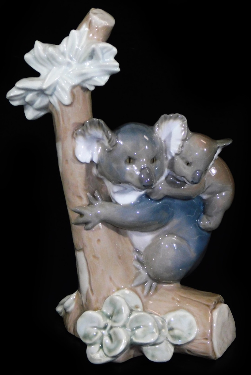 A Lladro figure group of a koala and young, on a tree branch, no. 5461, printed and impressed
