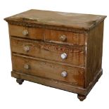 A 19thC pine chest, of two short and two long drawers, each with knob handles on turned bun feet,