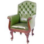 A 19thC mahogany library armchair, with button back arms and seat upholstered in later green