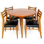 A vintage teak part dining room suite, comprising circular table and four chairs, each with curved