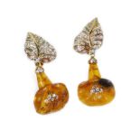 A pair of diamond and amber floral drop earrings, the leaf shaped earring top set with pave set tiny