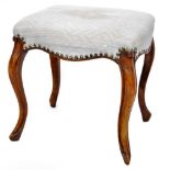 A 19thC stool, the serpentine top overstuffed in (later) textured blue material, on cabriole legs,
