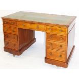 A 19thC mahogany desk, the one piece green leather top with tooled gilt scroll and floral decoration