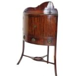 An early 20thC mahogany corner washstand, with two part galleried back raised above a pair of a