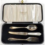 An Elizabeth II silver three piece christening set, comprising knife, fork and spoon, the knife with