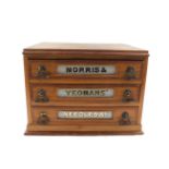 A late 19thC Morris and Yeoman's oak haberdashery chest, of three drawers, named to each drawer,