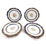 A set of nine early 19thC Coalport porcelain dessert plates, painted centrally with sprays of