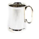 A George V silver tankard, of plain form, with glass bottom, Birmingham 1934, 8.12oz all in.