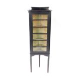A Victorian ebonised corner display cabinet, the glazed door opening to reveal five shelves,