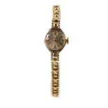 An Avia lady's 9ct gold cased wristwatch, circular champagne dial bearing Arabic numerals at 12