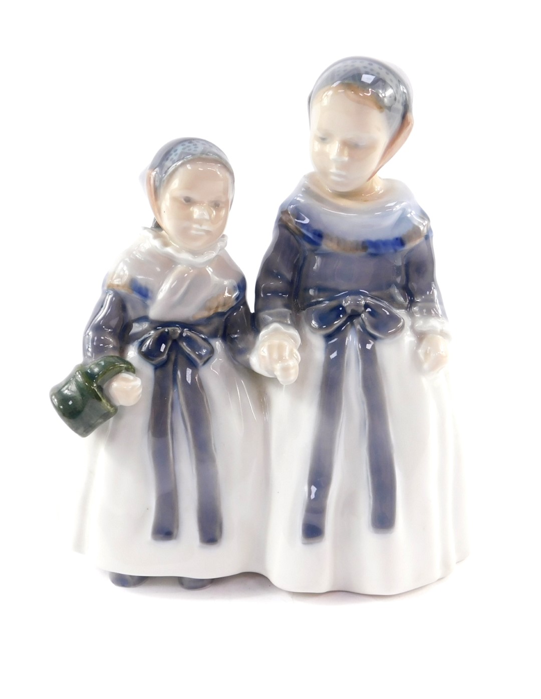 A Royal Copenhagen porcelain figure group of a pair of girls, holding hands, No 1316, printed and