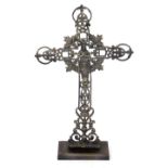 A French cast iron altar cross, cast with the Virgin Mary, roses and foliate scrolls, raised on a