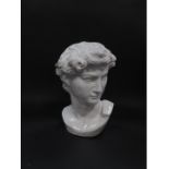 A white glazed pottery bust of David, after Michelangelo, 37cm H.