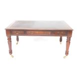 A Victorian mahogany desk, with a tooled brown leather top, over one long and two short drawers,