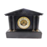 A late 19thC French slate mantel clock, circular brass dial, with enamel chapter ring bearing Arabic