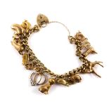 A 9ct gold curb link charm bracelet, with fourteen charms as fitted, on a heart shaped padlock, with