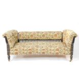 A late 19thC Gillows Aesthetic ebonised and gilt two seater sofa, with over stuffed back, button
