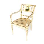 A Chinese Regency style carver chair, cream and gold painted, the back panel decorated with flowers,