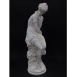 A plaster figure of Aphrodite, modelled seated on a circular base, 65cm H.