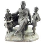 A Russian Soviet era bronze sculpture of Lenin, modelled seated on a bench with a girl reading at