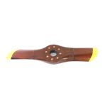 A vintage mahogany propeller, with brass stud work, painted yellow wing tips, 87cm W.