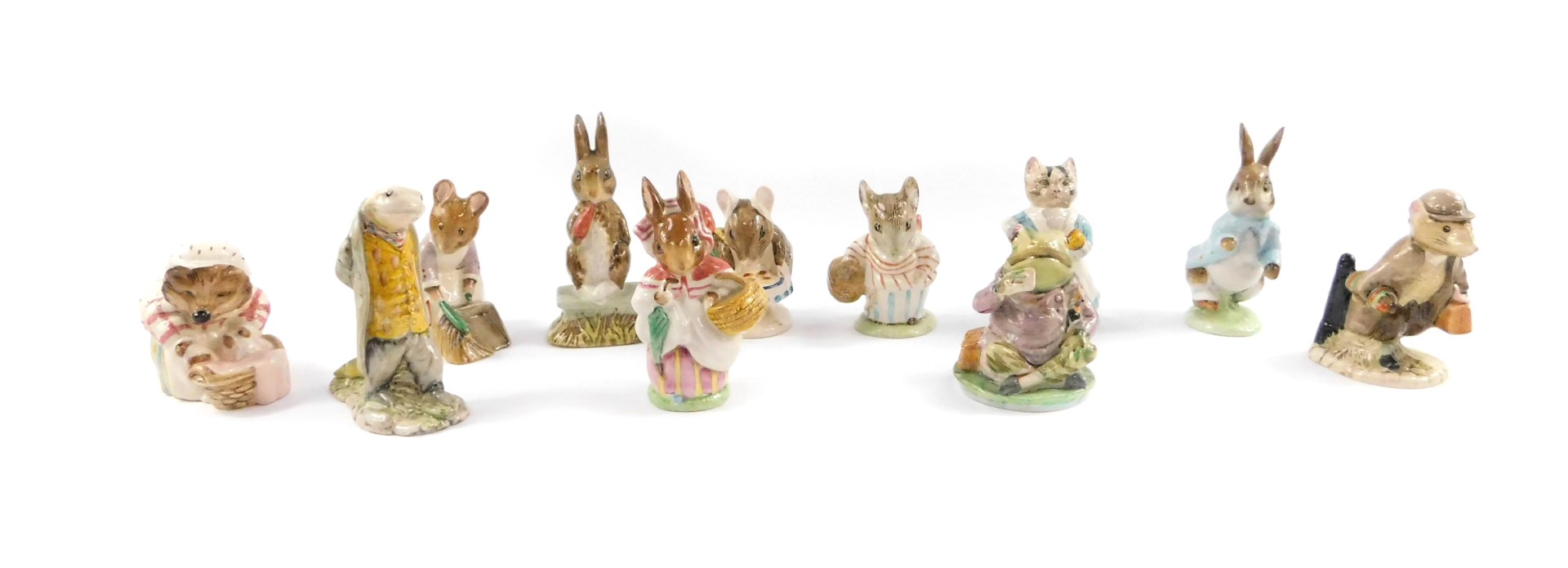 A group of Beatrix Potter figures, brown back stamp, comprising Fierce Bad Rabbit, Mrs