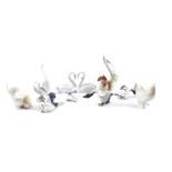 Lladro porcelain figures of birds, including three storks, cockerel and hen, a pair of swans,