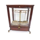 A set of 19thC balance scales by G Wolters, London, brass framed, glazed mahogany case, No.2, with