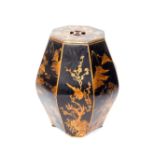 A Chinese lacquer octagonal container, with lid, decorated with panels of landscapes, birds and