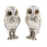 A pair of novelty silver owl salt and pepper shakers, each modelled standing, set with orange